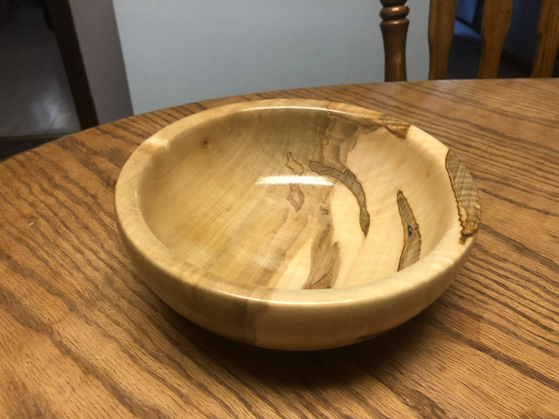 Turned spalted maple bowl on a table
