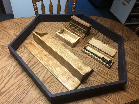 Hexagonal wooden tray with small workpieces