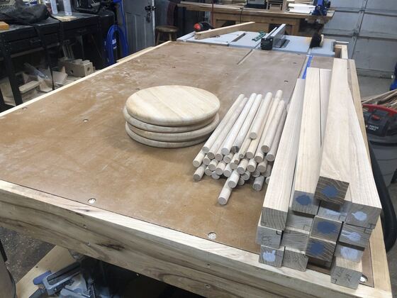 Bar stool parts laid out on a workbench