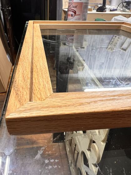 Corner detail of a quarter-sawn oak picture frame